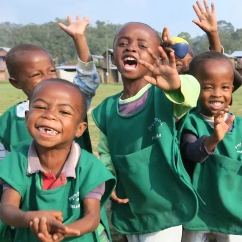 a group of happy children smilling at the camera